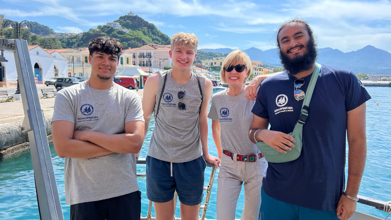 students smile in front of the Agean Sea in Greece 